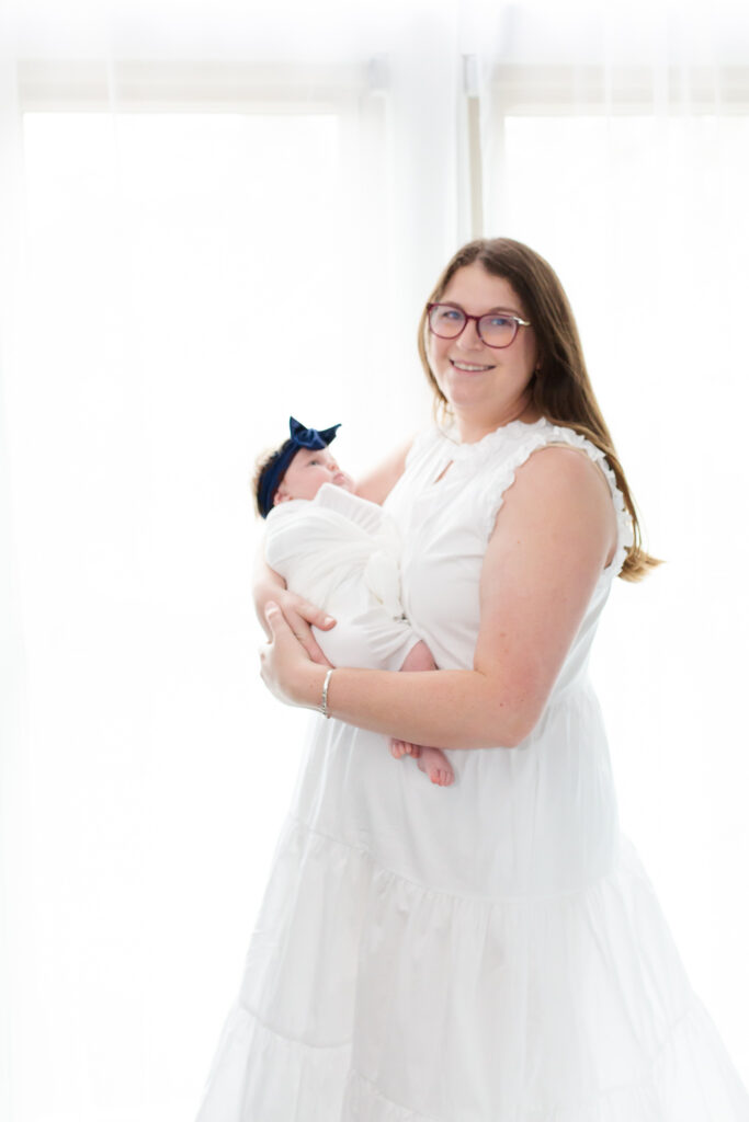 Mom and new baby in lifestlyle newborn session